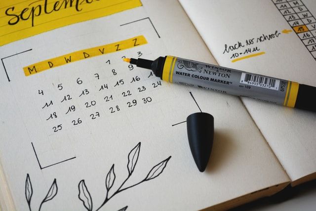 Calendar Book with September and yellow marker pen